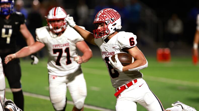 Tipp Jackson Davis carries the ball against Xenia during Friday's game. BILL LACKEY/STAFF