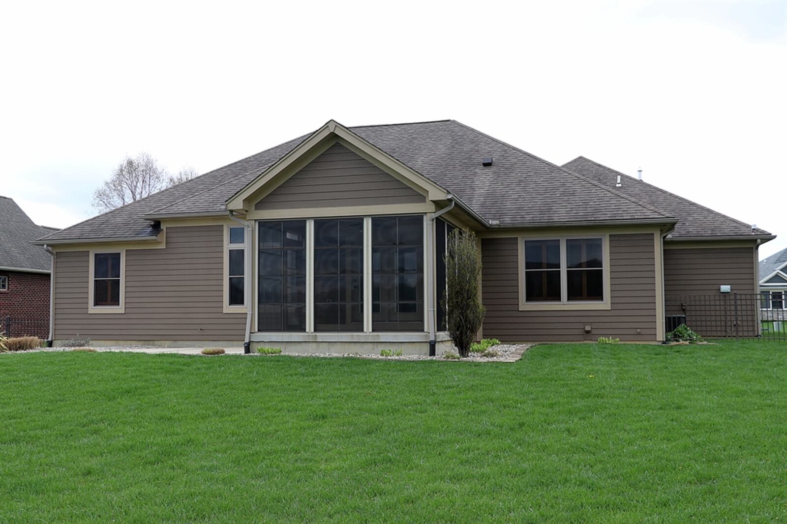 The property includes a tandem, four-car garage, a fenced backyard, a sun patio with gas-grill connections and a sprinkler system. 