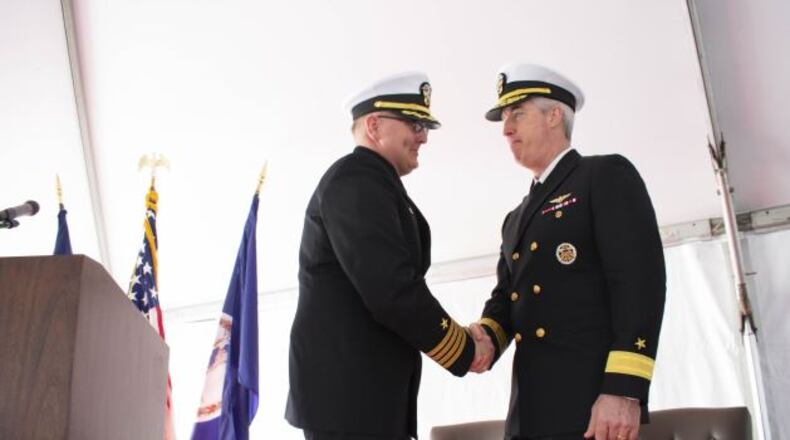 Rear Adm. John F. Meier Commander, Carrier Strike Group (CSG) 10 congratulates Capt. William K. Shafley, (left), Commander, Destroyer Squadron (DESRON) 26, at the change of command ceremony for DESRON26 aboard the guided-missile destroyer USS Truxtun (DDG 103). U.S. NAVY
