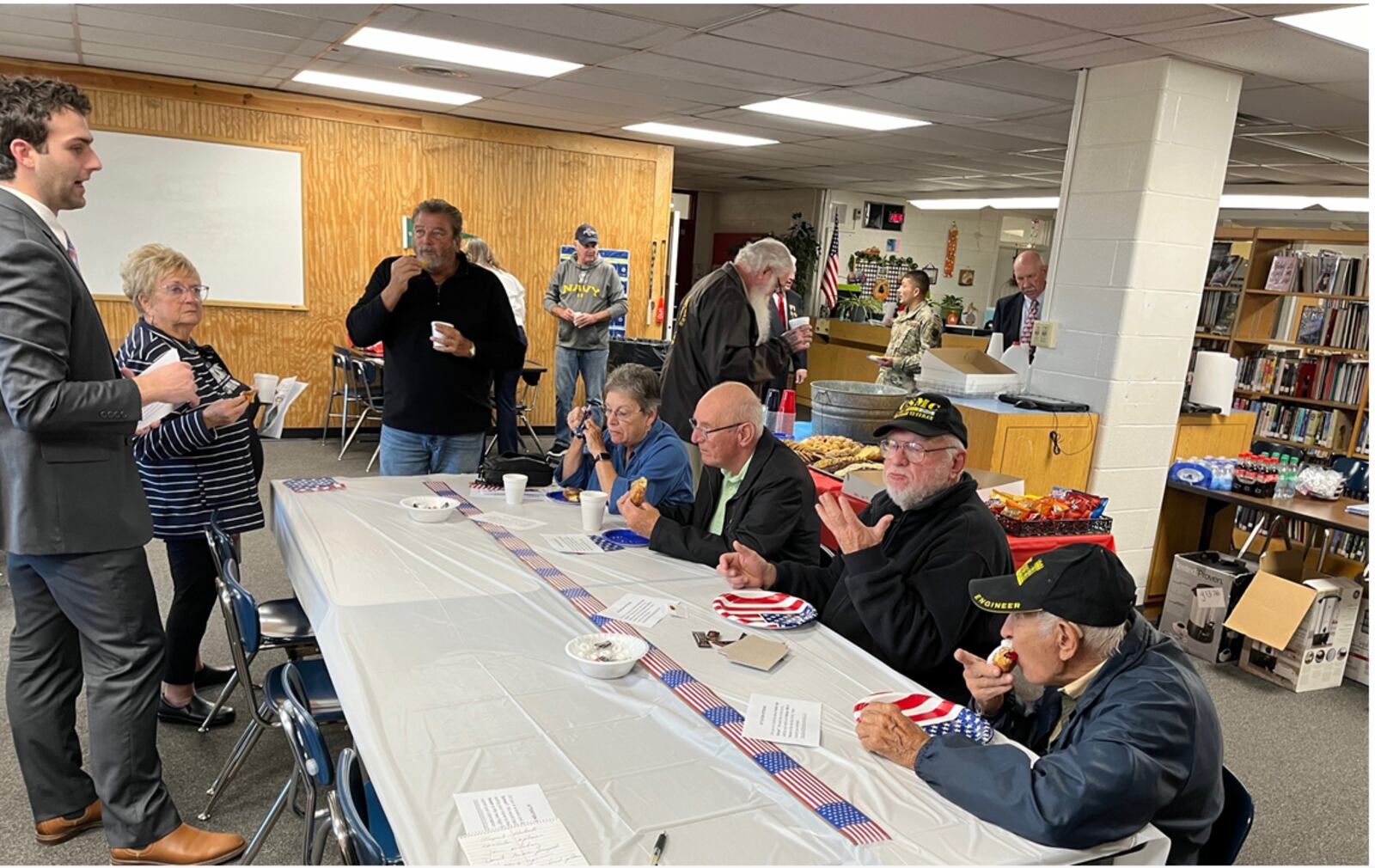 Local veterans enjoy a small reception at Franklin High School following the school's 23rd annual Veterans Day Program. ED RICHTER/STAFF