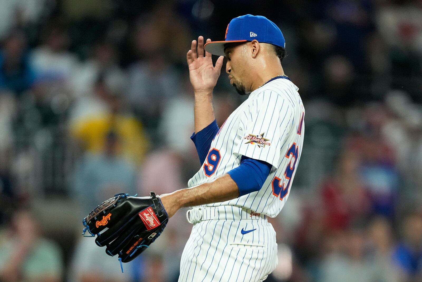 New York Mets pitcher Edwin Díaz calls for challenge during ninth inning at the MLB baseball All-Star game between the American League and National League, Tuesday, July 15, 2025, in Atlanta. (AP Photo/Brynn Anderson)