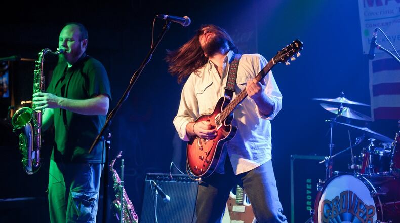 Michael Bisig (left) and Jeff May of Grover celebrate the release of the Yellow Springs-based jam band’s new album, “Tonight Only,” at Peach’s Grill in Yellow Springs on Friday, Jan. 22, 2016. CONTRIBUTED
