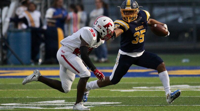 Springfields Jeff Tolliver runs against Fairfields Nykel Bell on Friday, Sept. 6, 2019, at Springfield High School. David Jablonski/Staff