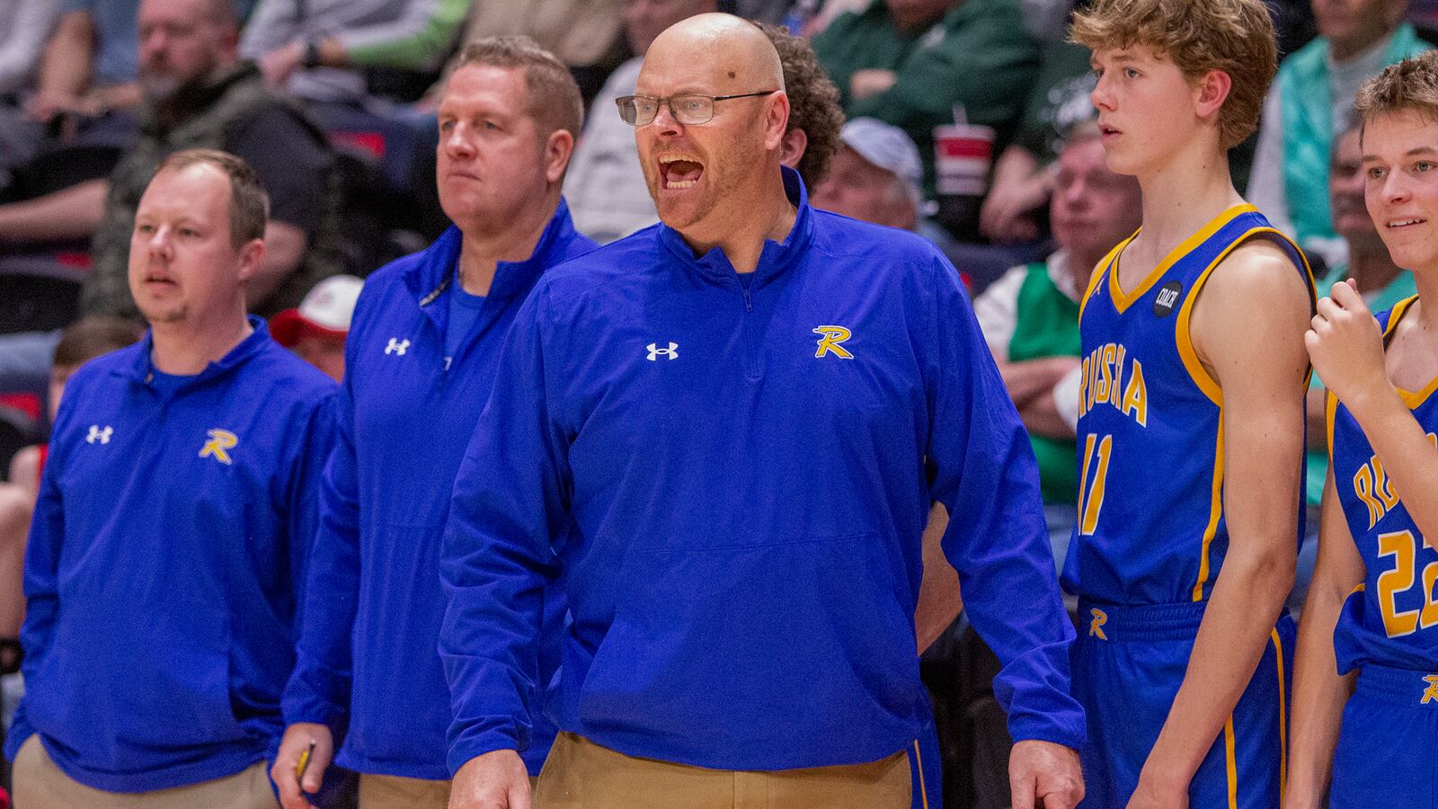Russia interim head coach Spencer Cordonnier, with freshman coach Nick Leffel behind him and JV coach Cody Anthony on the far left, exhorts his team during last week's Division IV district final against Catholic Central at UD Arena. CONTRIBUTED/Jeff Gilbert