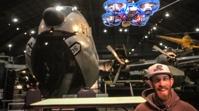 Micro-drone race organizer, Kele Stanley flies a drone for the media to promote their Saturday drone race at the USAF Museum.
