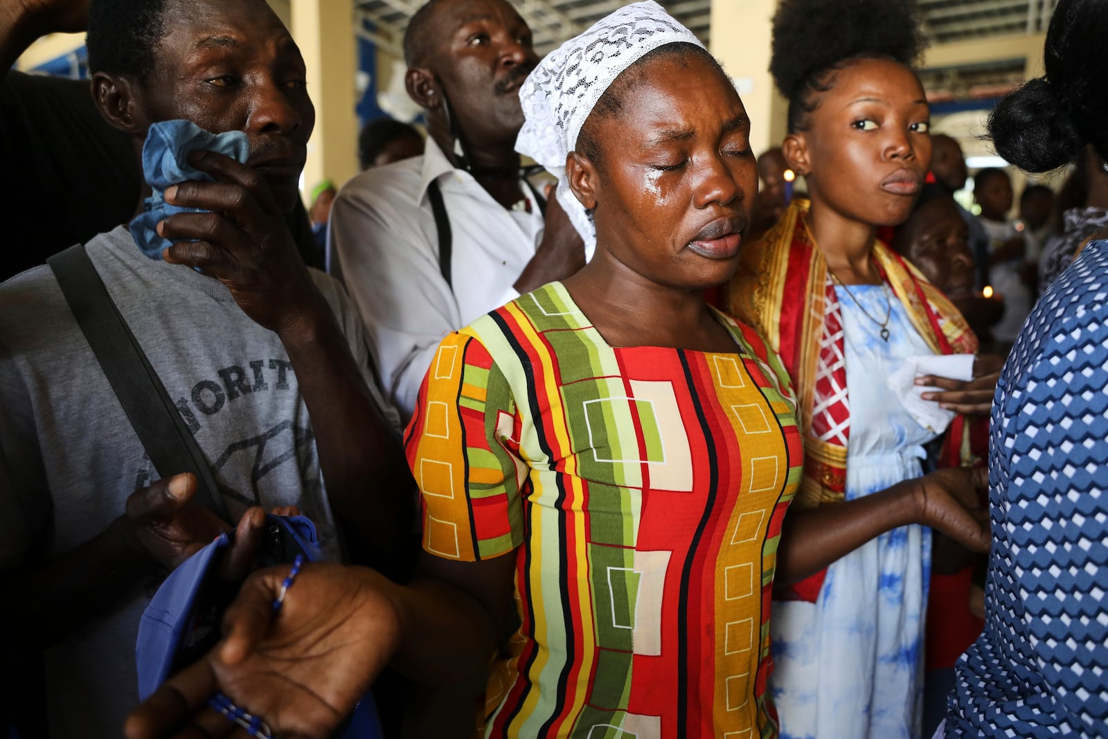 Pilgrims attend a Mass celebrating the Feast of Our Lady of Mount Carmel at the namesake church in the Pétion-Ville neighborhood of Port-au-Prince, Haiti, on Wednesday, July 16, 2025. (AP Photo/Odelyn Joseph)