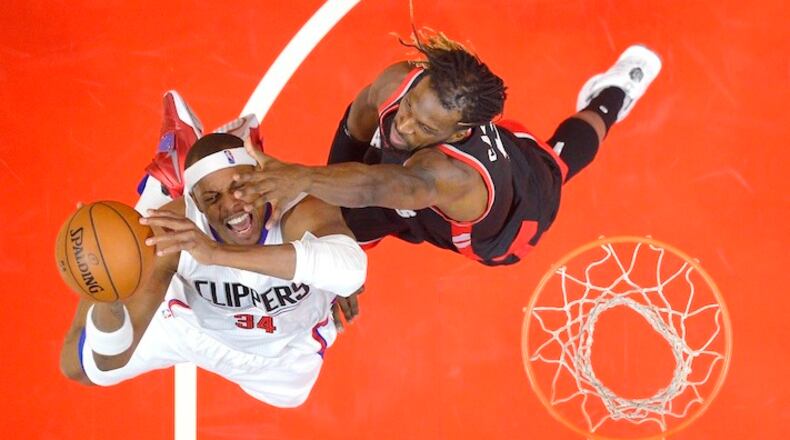 Los Angeles Clippers forward Paul Pierce, left, shoots as Toronto Raptors forward DeMarre Carroll defends during the first half of an NBA basketball game Sunday, Nov. 22, 2015, in Los Angeles. (AP Photo/Mark J. Terrill)