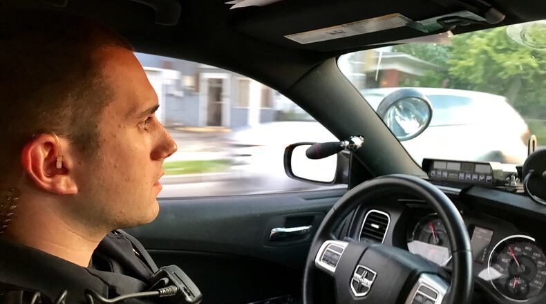 Springfield Police Division officer Justin Massie drives down Selma Road as he responds to a call for service on June 5. MICHAEL COOPER/STAFF