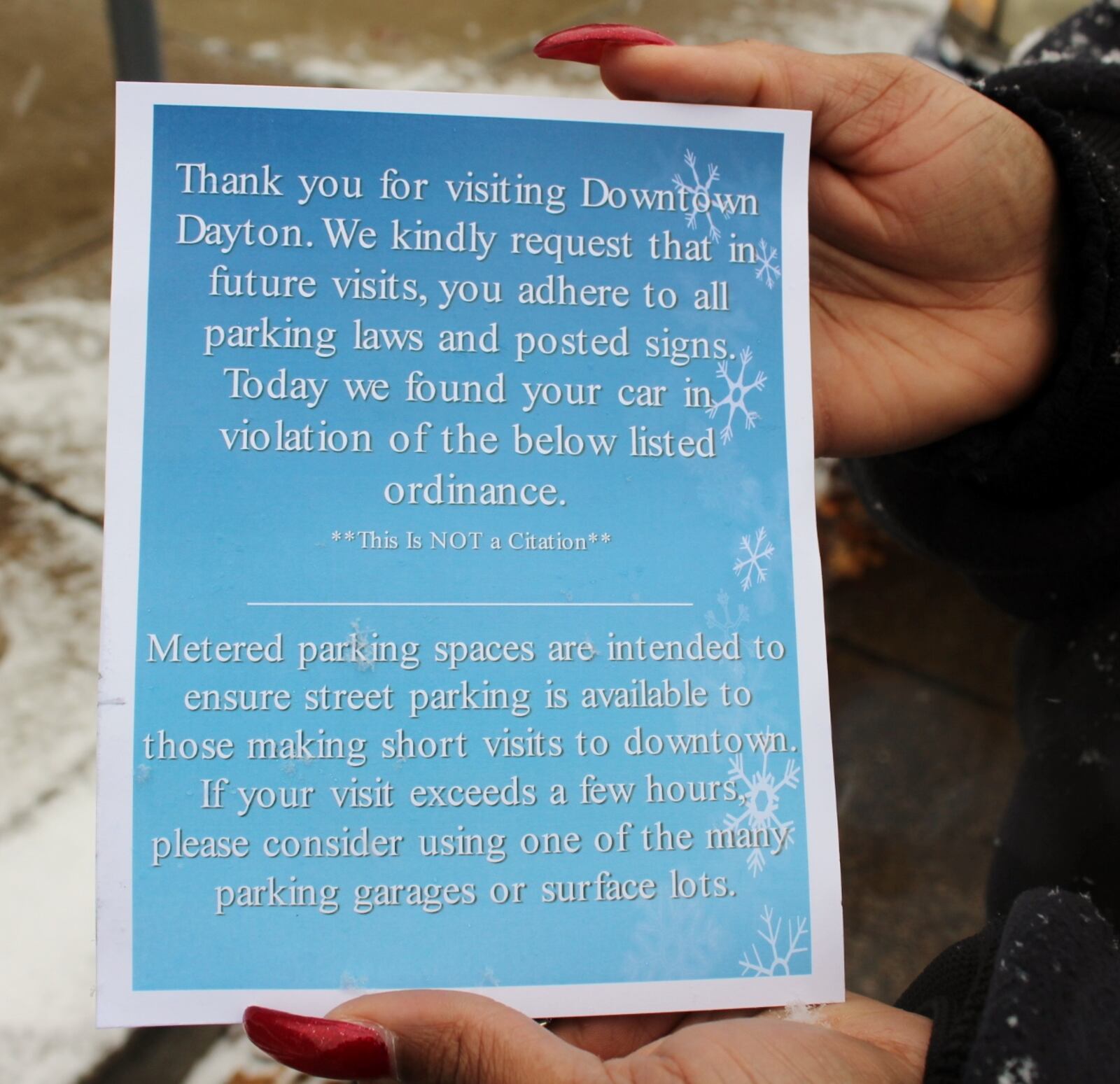 The front side of the City's parking violation warning card. CONTRIBUTED.