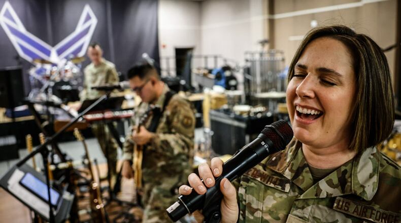 Air Force Band of Flight singer, Ainsley DeWitt practice Christmas tunes at the band's practice facility at WPAFB Wednesday December 6, 2023. JIM NOELKER/STAFF