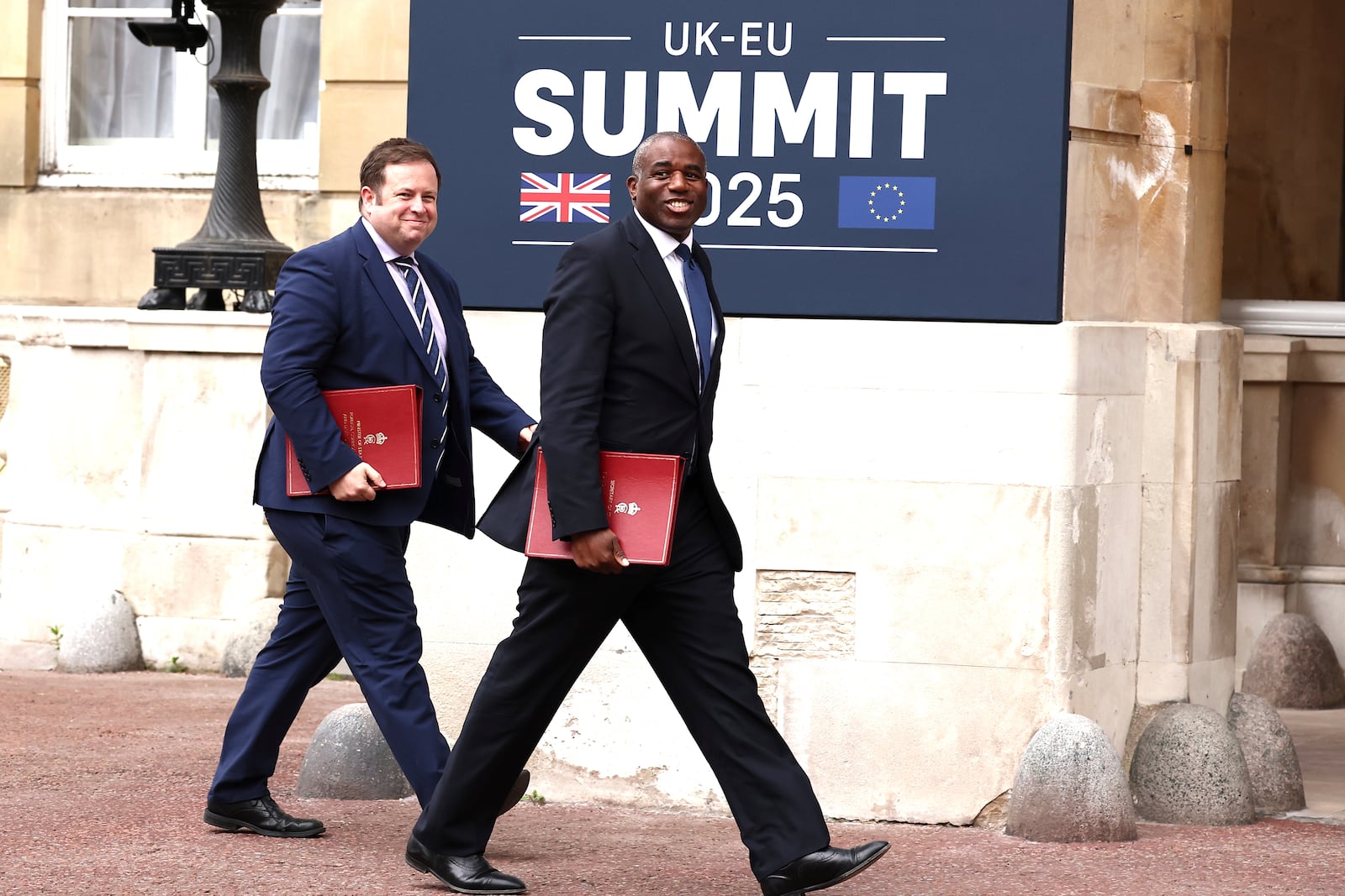 Britain's Foreign Secretary David Lammy, foreground, arrives to attend the UK-EU Summit at Lancaster House, in London, Monday, May 19, 2025. (Henry Nicholls/Pool Photo via AP)