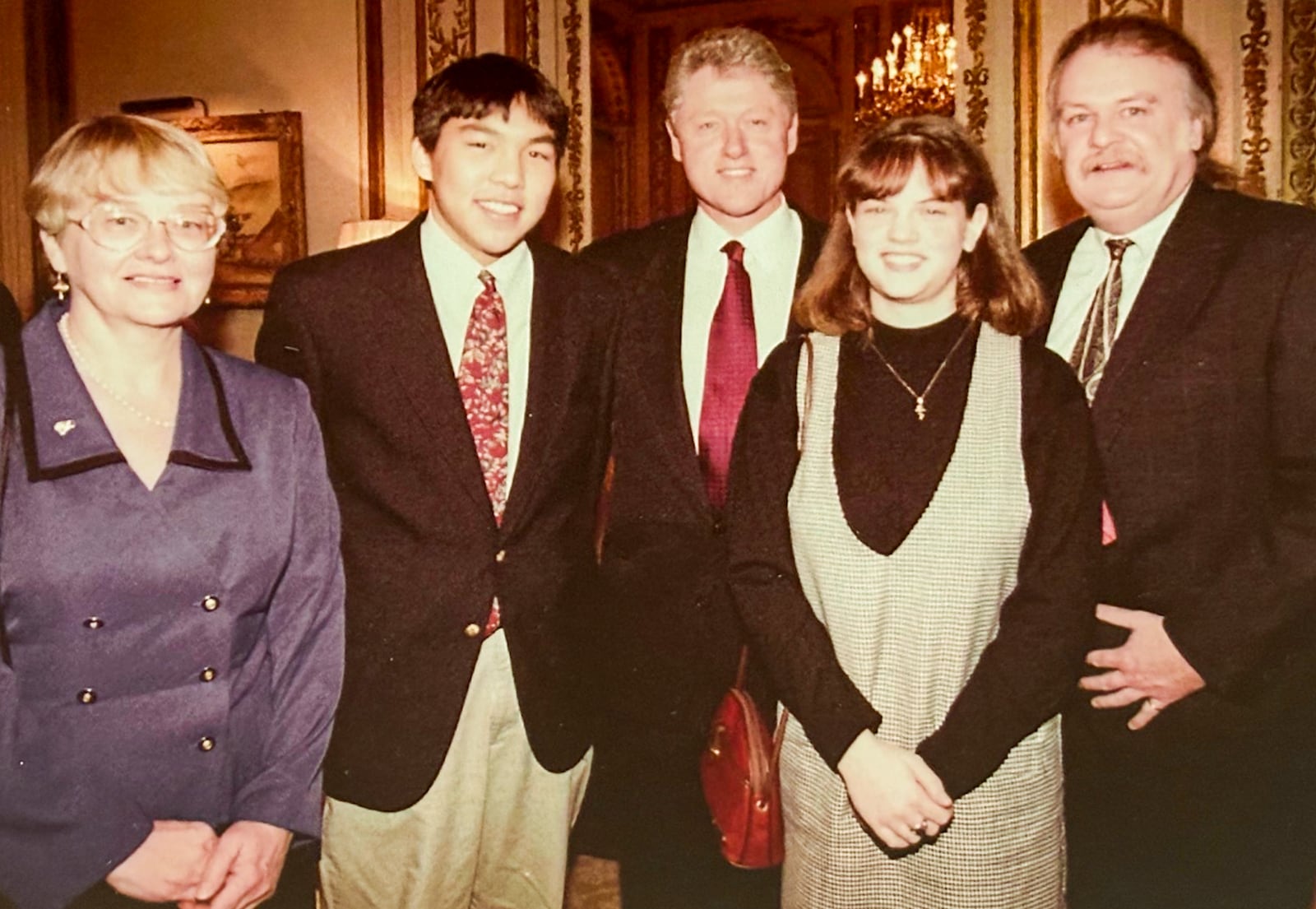 From left: Maija Racevskis, John Kim, President Bill Clinton, Julie Waszczak and Tom Archdeacon. (CONTRIBUTED)