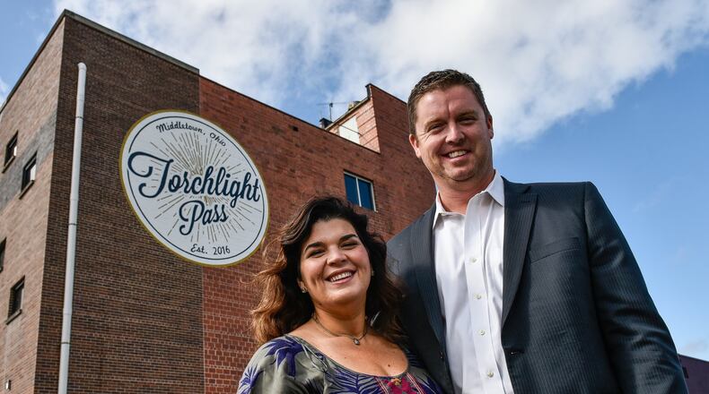 Ami Vitori stands with her husband Kevin Kimener outside the Torchlight Pass building in October. NICK GRAHAM/STAFF Ami Vitori stands with her husband Kevin Kimener outside the Torchlight Pass building Wednesday, Oct. 11 in Middletown. Middletown is among 11 communities featured in season two of “Upstanders, ” an original Starbucks series. The episode is titled “Saving Middletown.” The five-minute film features the story of Ami Vitori, the founder of Torchlight Pass. NICK GRAHAM/STAFF