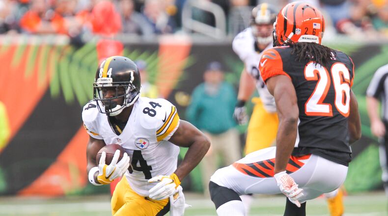 Pittsburgh wide receiver Antonio Brown (84) make a catch for a first down during their games against the Bengals at Paul Brown Stadium in Cincinnati, Sunday, Dec. 13, 2015. GREG LYNCH / STAFF