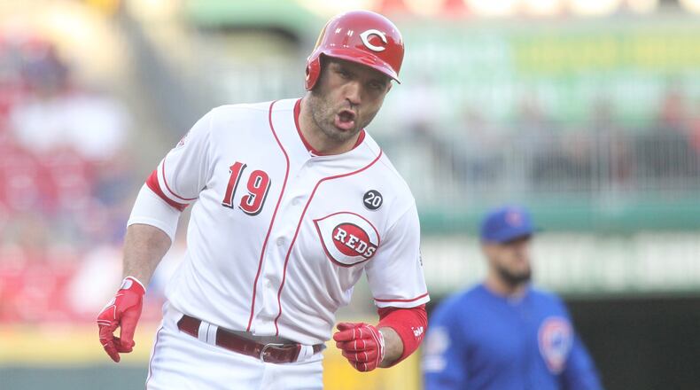 The Reds’ Joey Votto rounds the bases after a home run on Tuesday, May 14, 2019, at Great American Ball Park in Cincinnati. David Jablonski/Staff