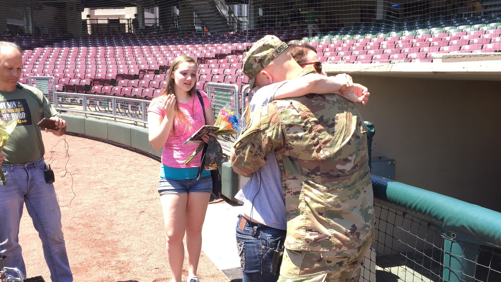 Army Pfc. Mitchell Kirtley embraces his mother Jody Kirtley at Fifth Third Field after he returned home from active duty in Afghanistan. JIM OTTE / STAFF PHOTO