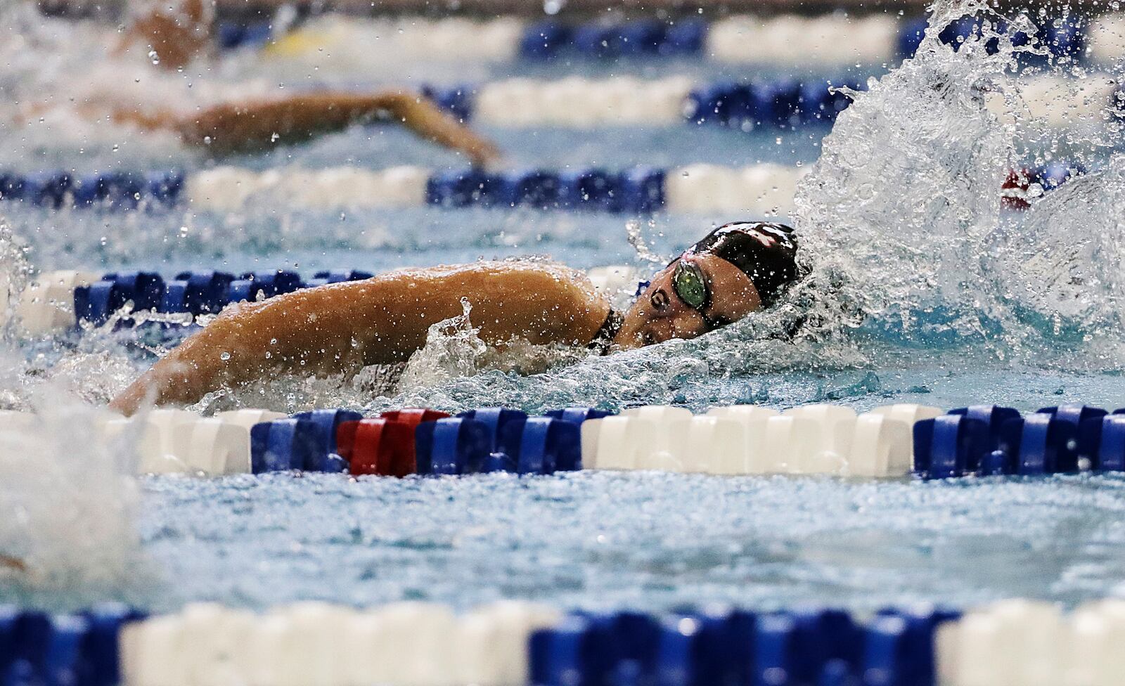 FILE - Georgia's Olivia Smoliga swims to a first-place finish in the 100-yard freestyle at the NCAA women's swimming and diving championships at Georgia Tech, March 19, 2016, in Atlanta. (AP Photo/David Goldman, File)