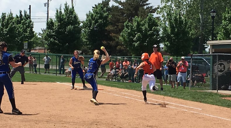 Bradford’s Chelsea Gill puts down a successful sacrifice bunt during Sunday afternoon’s Division IV district final against Cincinnati Christian at Mason. That’s CCS first baseman Jenna Monk fielding the ball and and throwing to second baseman Karli Head as pitcher Briahna Bush watches. RICK CASSANO/STAFF