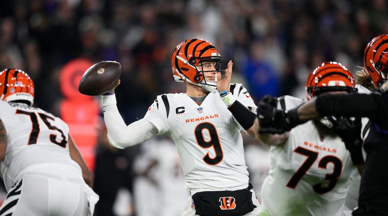 Cincinnati Bengals quarterback Joe Burrow (9) looks to pass in the first half of an NFL football game against the Baltimore Ravens in Baltimore, Thursday, Nov. 16, 2023. (AP Photo/Nick Wass)