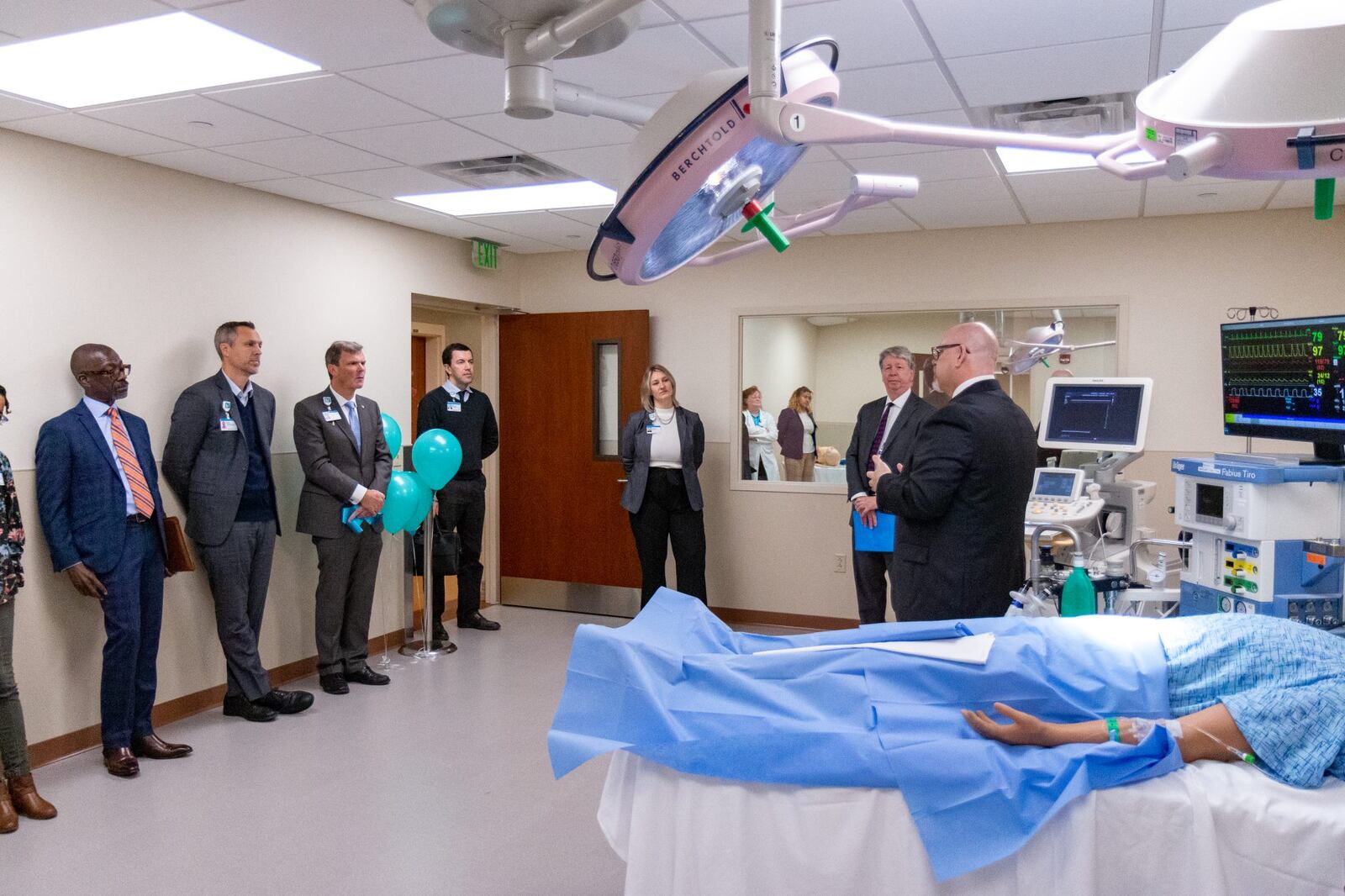 Phillip Smith, Simulation Technology Coordinator, explains the lab's cutting-edge technology to Kettering College and Kettering Health leadership. Photo by Joel Granados, Kettering College Communications Specialist