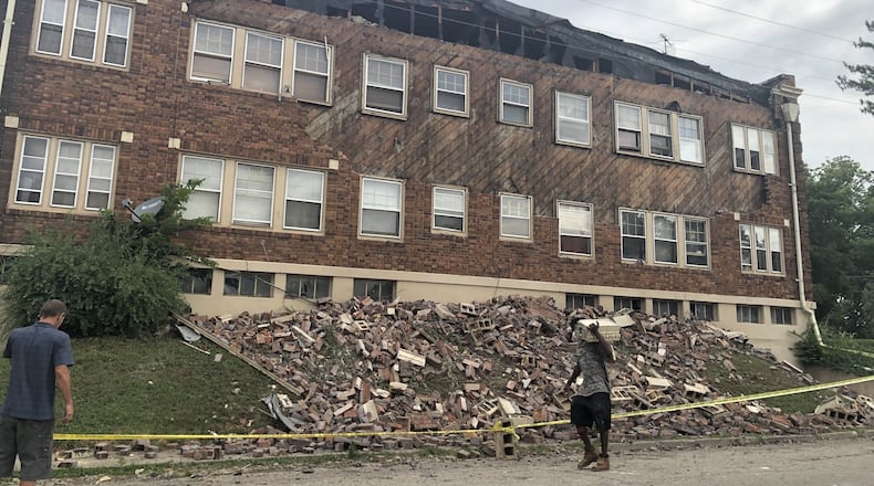 The facade of an apartment building on the 1100 block of Salem Avenue came tumbling down on Monday. CORNELIUS FROLIK / STAFF