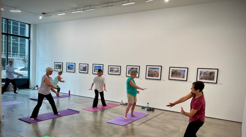 As part of the Dayton Arcade’s arts and wellness summer series, Leslie Dworkin is teaching Qigong on Thursdays at The Contemporary Dayton. NATALIE JONES/STAFF