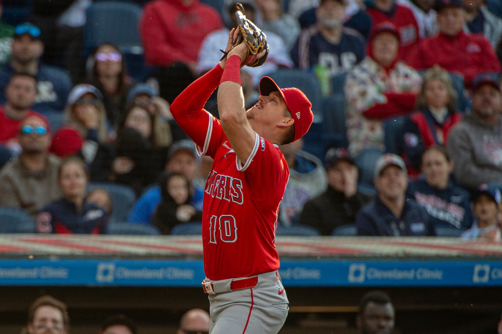 Los Angeles Angels' Kevin Newman catches a pop fly by Cleveland Guardians' Angel Martinez during the eighth inning of a baseball game, Saturday, May 31, 2025, in Cleveland. (AP Photo/Phil Long)