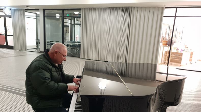 Oleg Osadcyi performs an original composition on the Dayton Arcade's piano. (Photo Credit: Ismael David Mujahid)