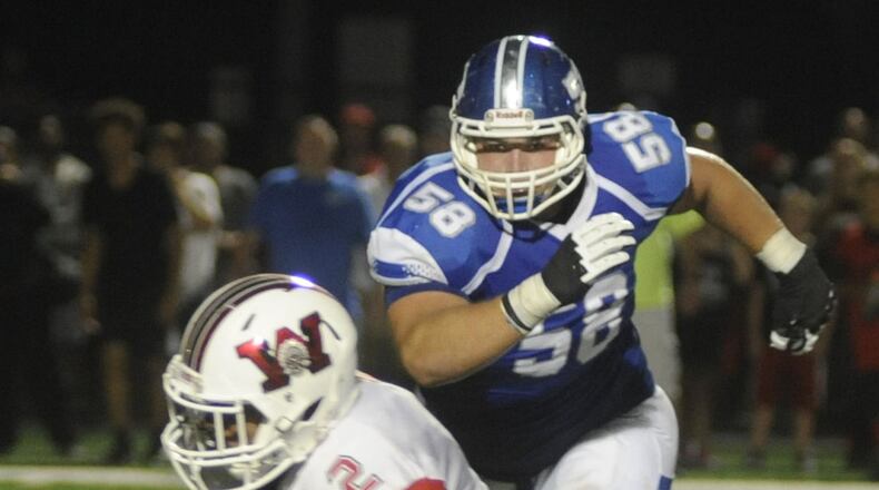 Miamisburg lineman Josh Myers (58) bears down on Wayne running back Fred Pitts. Both were named first team All-Southwest District by the Associated Press on Thursday. MARC PENDLETON / STAFF