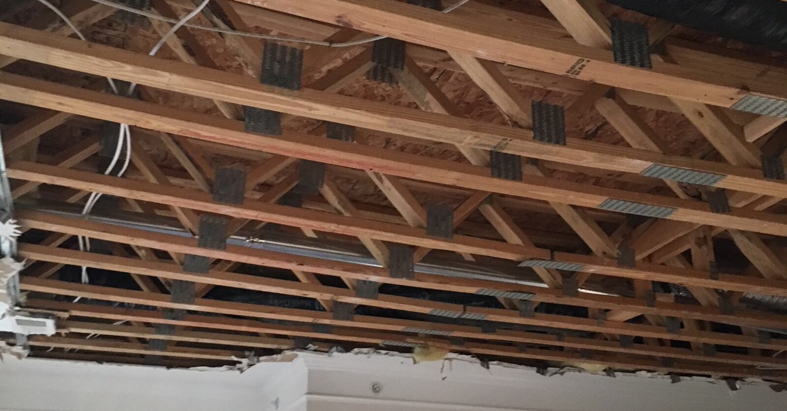 The ceiling drywall to a second-floor apartment was removed to expose structural damages at the Province Apartments in Bath Twp., Greene County.