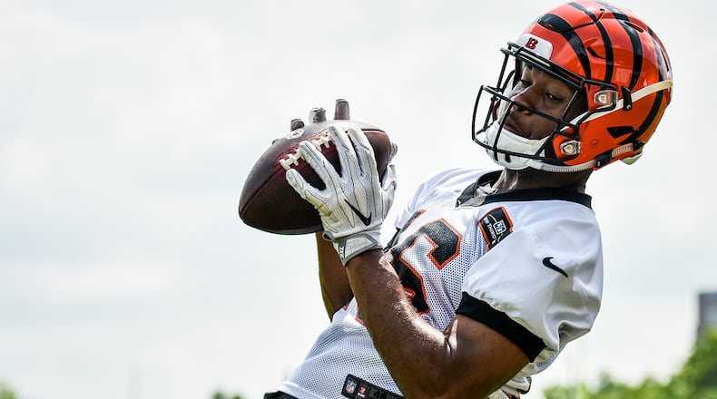 Cincinnati Bengals wide receiver Cody Core catches a pass during practice. NICK GRAHAM/STAFF