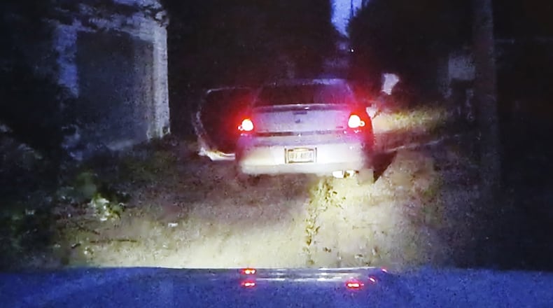 Cruiser camera video shows a suspect fleeing this car during a Dayton Police stop. An officer pursued the suspect. The pursuit ended with a Dayton police officer-involved shooting and the death of the man wounded during an apparent struggle near West Third Street and Delphos Ave. on Thursday night. DAYTON POLICE DEPARTMENT