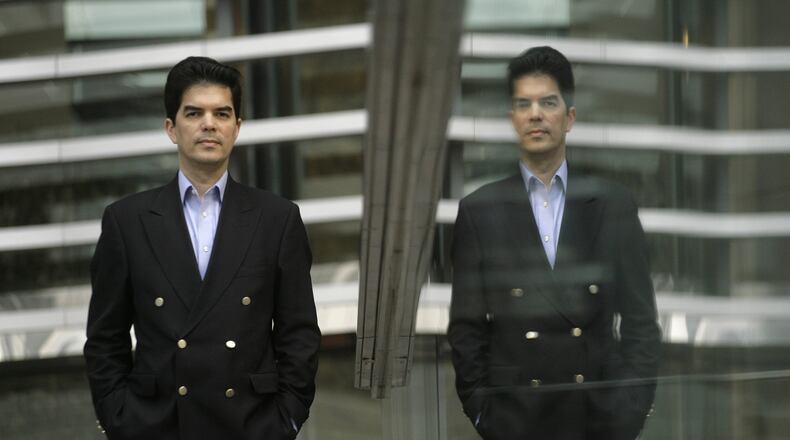 FILE - David Webb, a corporate governance activist poses for a photo after an interview with The Associated Press in Hong Kong, Tuesday, March 11, 2008. (AP Photo/Vincent Yu, File)