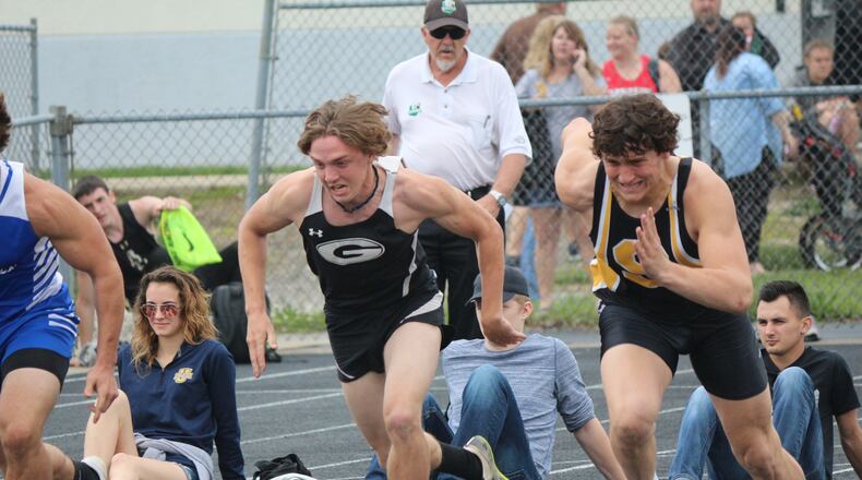 Greenon’s Derek Brown (left) and Shawnee’s Jack McCrory break out of the blocks during the 100 dash at the Division II district meet Saturday at Graham High School. Brown wilal be a starting running back/defensive back this fall for the football team. GREG BILLING / CONTRIBUTED