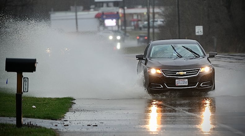 Heavy rain Friday, March 3, 2023 cause lots of roads to have standing water like Upper Valley Pike in Springfield. MARSHALL GORBY \STAFF