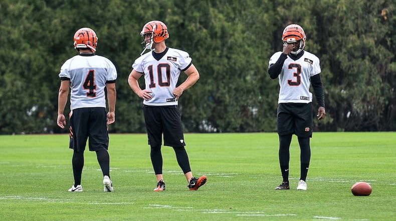 Bengals’ kickers Randy Bullock (4), Kevin Huber (10) and Jonathan Brown (3) prepare for kicking drills during organized team activities Tuesday, May 22 at the practice facility near Paul Brown Stadium in Cincinnati. NICK GRAHAM/STAFF
