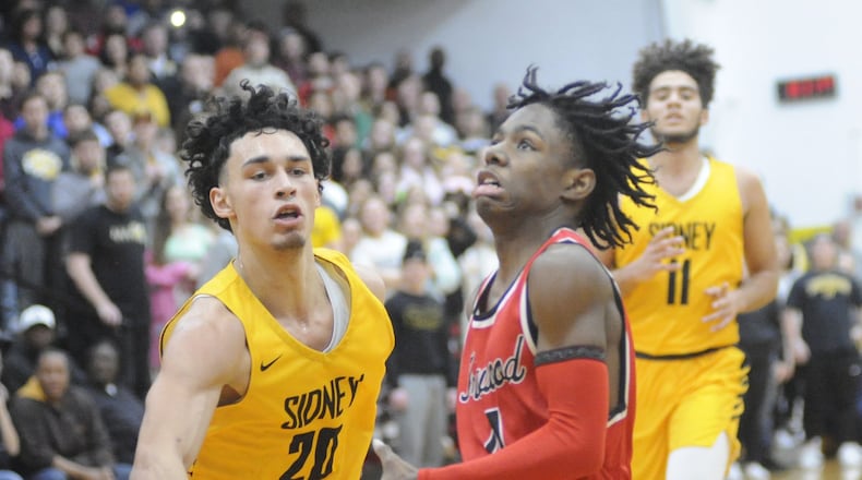 Trotwood-Madison sophomore Carter Mims (with ball) gets past Andre Gordon of Sidney during the visiting Rams’ 90-69 win on Friday, Jan. 18, 2019. MARC PENDLETON / STAFF