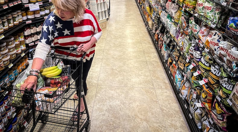 Kayt Senn-Grilliot, from Dayton shops for her Fourth of July holiday get together at Dorothy Lane Market in Oakwood Friday July 2, 2021.