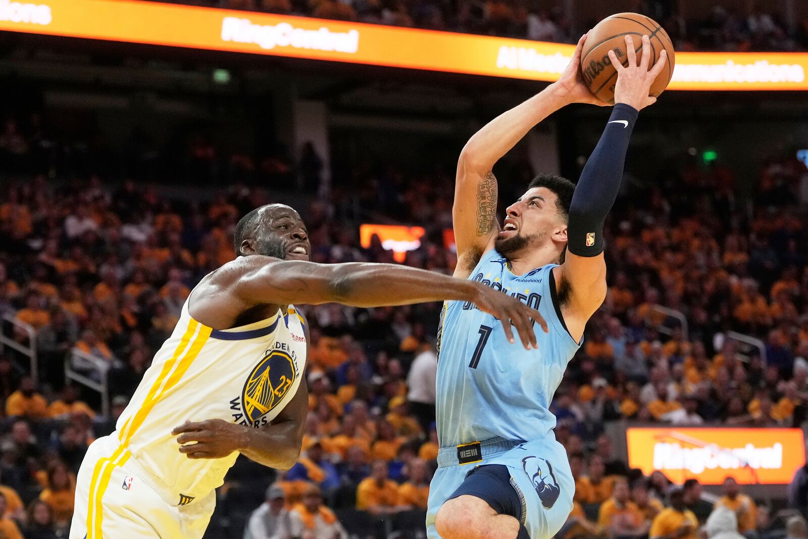Memphis Grizzlies guard Scotty Pippen Jr. (1) shoots against Golden State Warriors forward Draymond Green during the second half of an NBA play-in tournament basketball game in San Francisco, Tuesday, April 15, 2025. (AP Photo/Jeff Chiu)