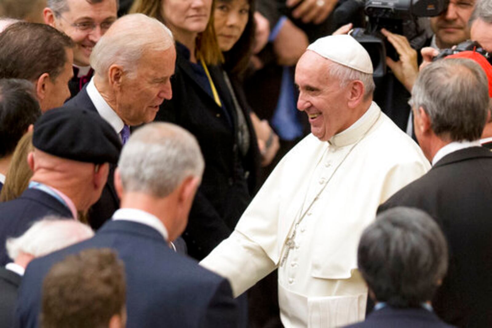 FILE - United States Vice President Joe Biden, left, shakes hands with Pope Francis during a congress on the progress of regenerative medicine held at the Vatican, Friday, April 29, 2016. (AP Photo/Andrew Medichini, File)