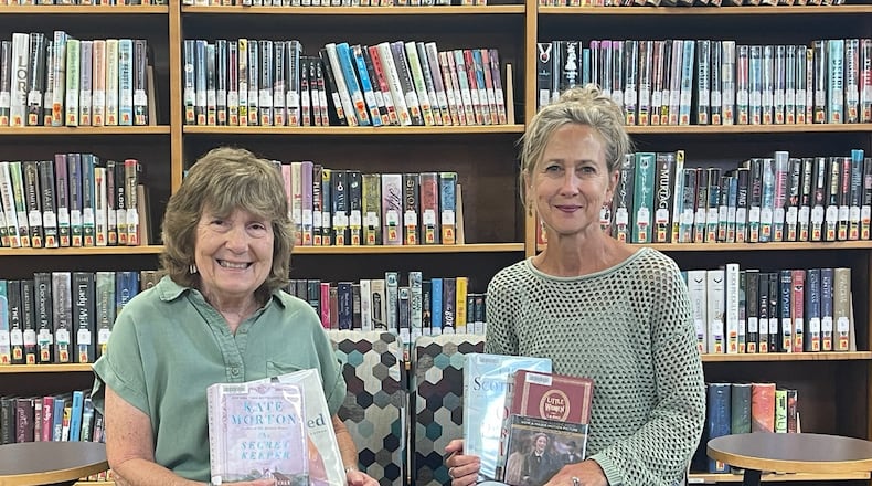 Cutline: Librarians Pam Dittner (left) and  Chris Williams facilitate The Rowdy Readers book club at Brown Memorial Library. CONTRIBUTED