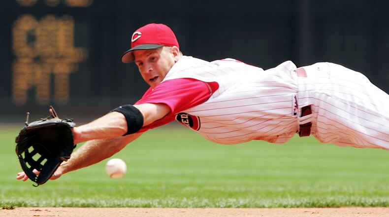 The Reds' Ryan Freel reaches for a ball during the Reds 9-5 win over the Chicago Cubs on July 21, 2005 at Great American Ballpark in Cincinnati, Ohio. (Photo by Andy Lyons/Getty Images)