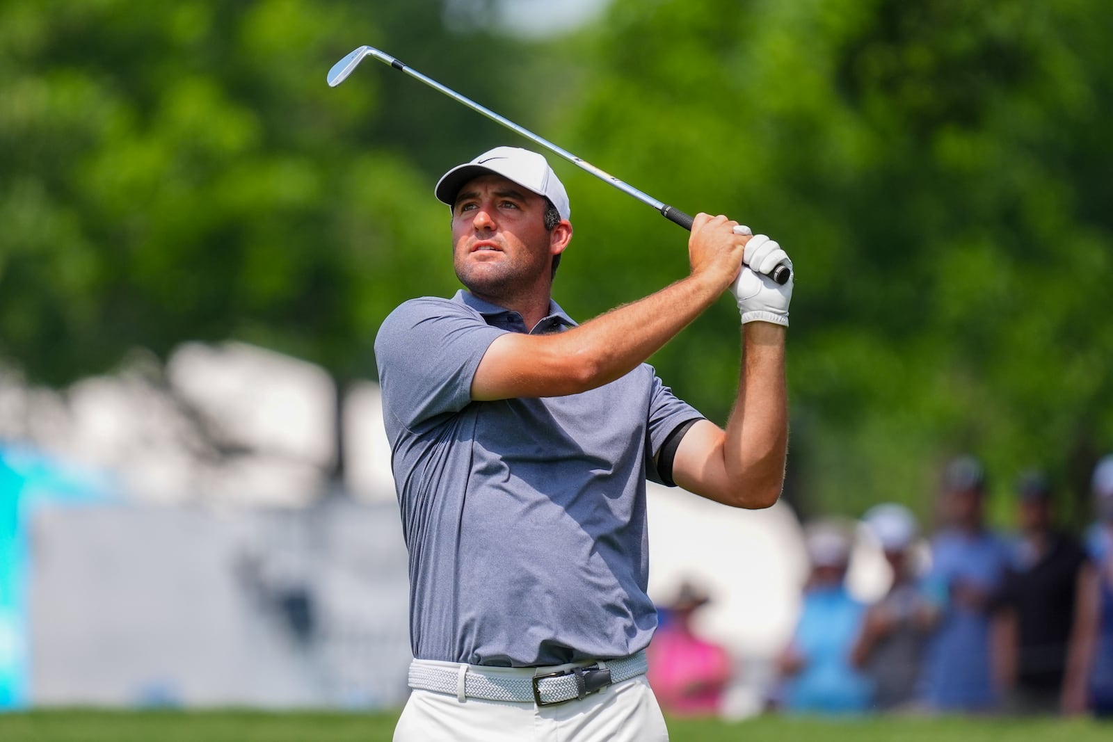 Scottie Scheffler hits a shot on the first hole fairway during the final round of the Charles Schwab Challenge golf tournament at Colonial Country Club in Fort Worth, Texas, Sunday, May 25, 2025. (AP Photo/LM Otero)