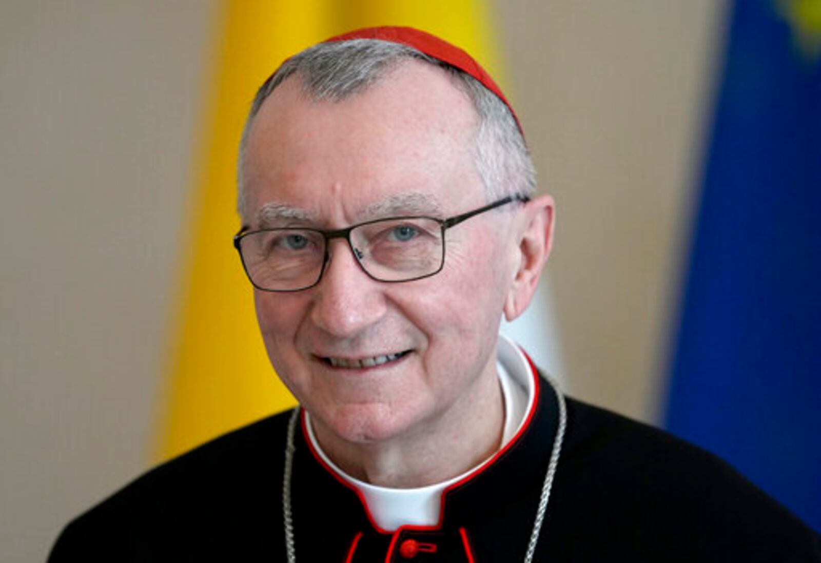 FILE - Vatican Secretary of State Cardinal Pietro Parolin smiles as he is welcomed by German President Frank-Walter Steinmeier for a meeting at the Bellevue palace in Berlin, Germany, Tuesday, June 29, 2021. (AP Photo/Michael Sohn, file)