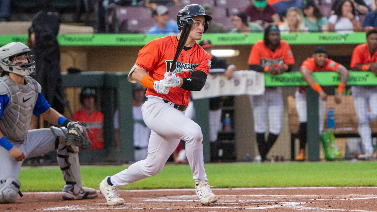 New catcher Ryan McCrystal singles for his first hit as a Dragon in the second inning Friday night at Day Air Ballpark. Jeff Gilbert/CONTRIBUTED