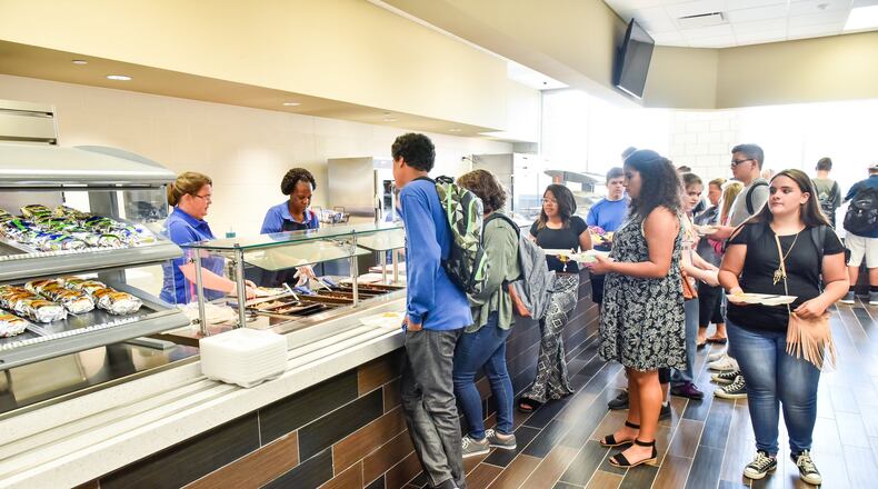 Students eat lunch in the cafeteria on the first day at Middletown High School Tuesday, Aug. 22 in Middletown. NICK GRAHAM/STAFF