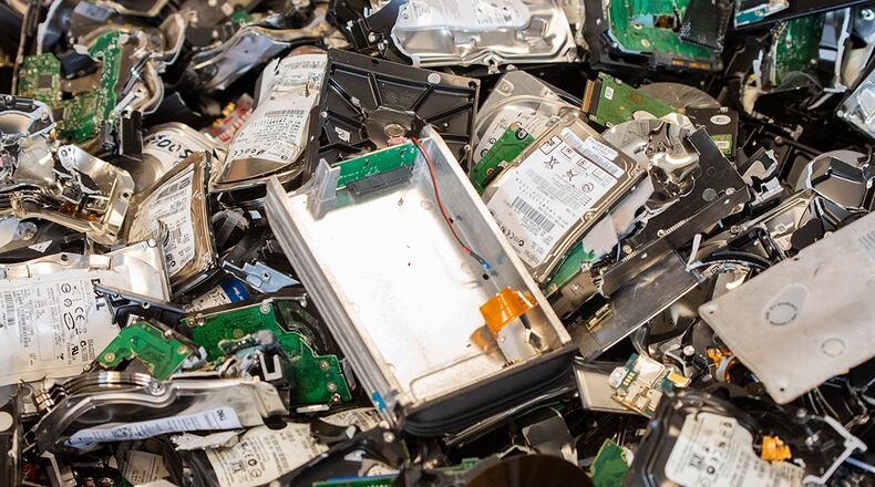 Metal pieces from hard drives and other electronics that have been destroyed sit inside a large box March 11 during Classified Cleanout Day at Wright-Patterson Air Force Base. Throughout the day, more than 2,400 items were destroyed and 560 pounds of paper shredded. U.S. AIR FORCE PHOTO/WESLEY FARNSWORTH