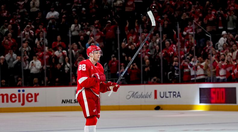 Detroit Red Wings right wing Patrick Kane celebrates after scoring his 500th career goal during the third period of an NHL hockey game against the Vancouver Canucks Thursday, Jan. 8, 2026, in Detroit. (AP Photo/Ryan Sun)