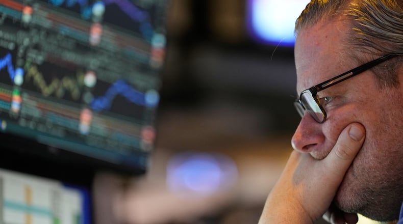Gregg Maloney works on the floor at the New York Stock Exchange in New York, Wednesday, Dec. 10, 2025. (AP Photo/Seth Wenig)