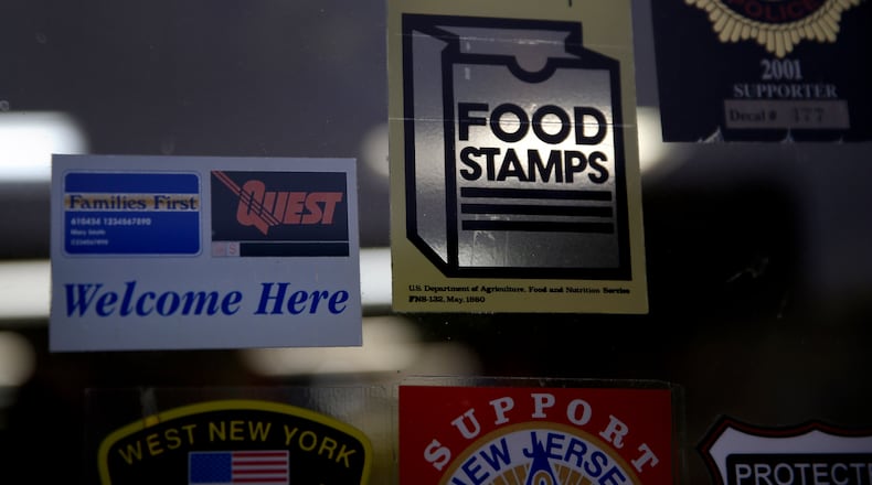 Asupermarket displays stickers indicating they accept food stamps. (AP Photo/Seth Wenig, File)